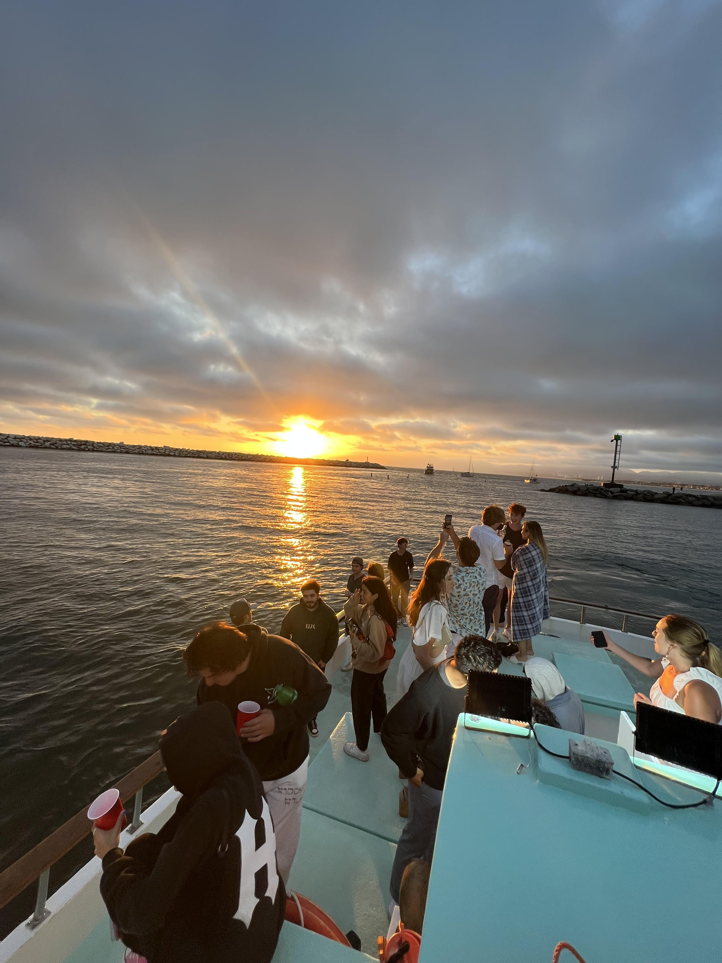Guests aboard Sea Trek enjoying a private charter at sunset near Marina del Rey