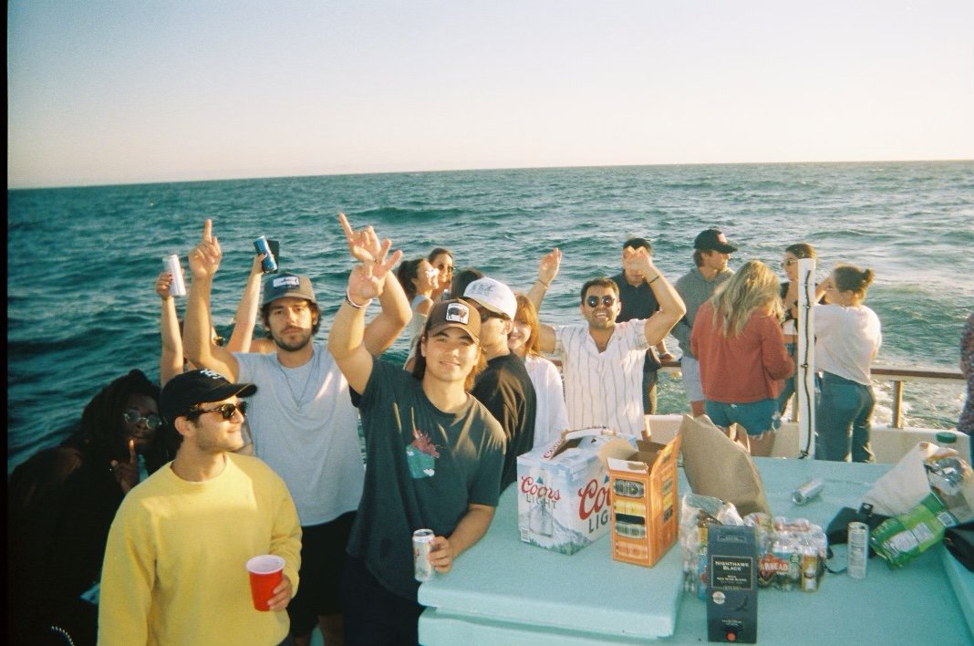Guests enjoying food and drinks on Sea Trek during a private ocean charter