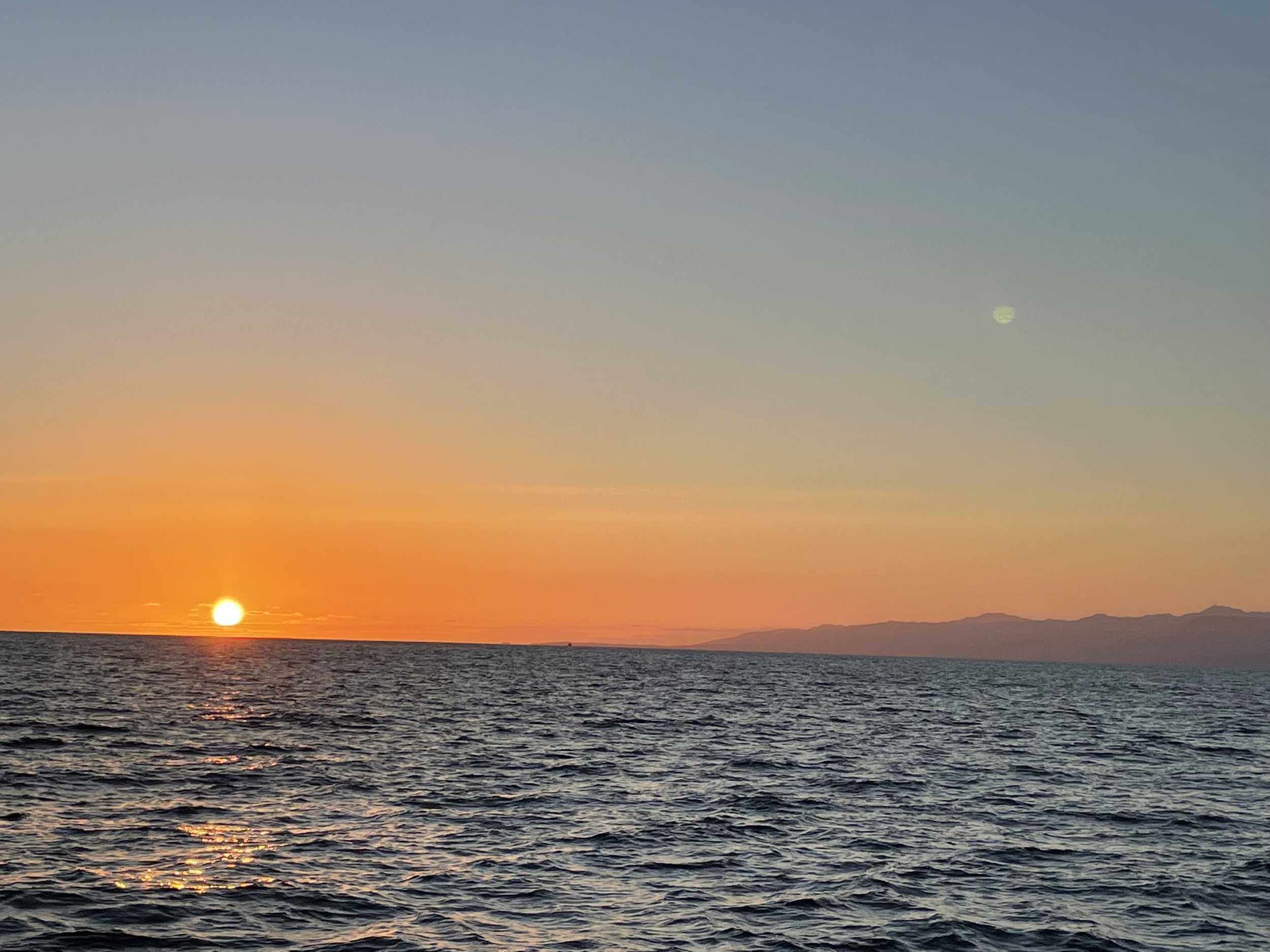 Pacific Ocean sunset viewed during a Sea Trek coastal cruise
