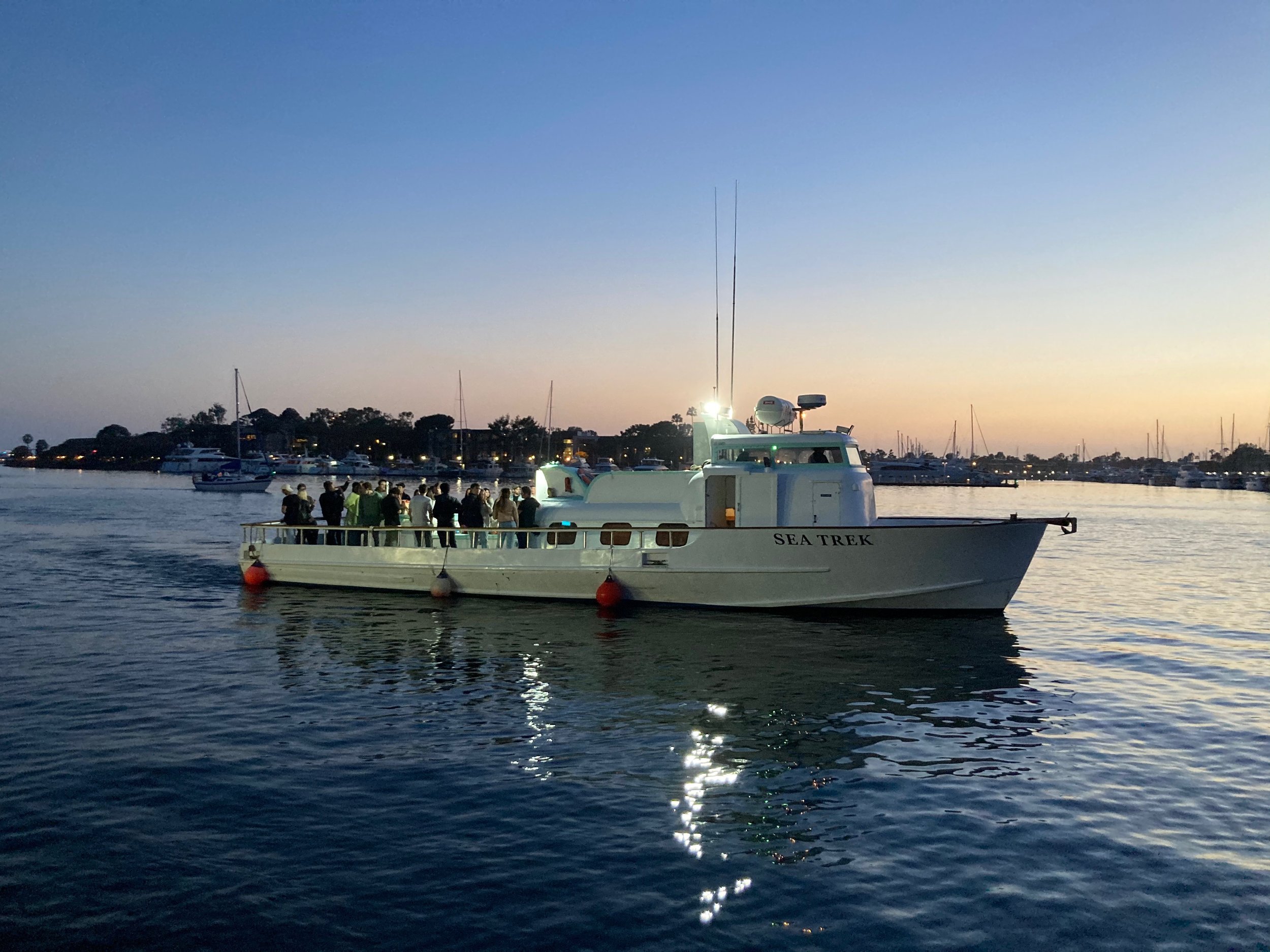 Sea Trek carrying guests through Marina del Rey at twilight