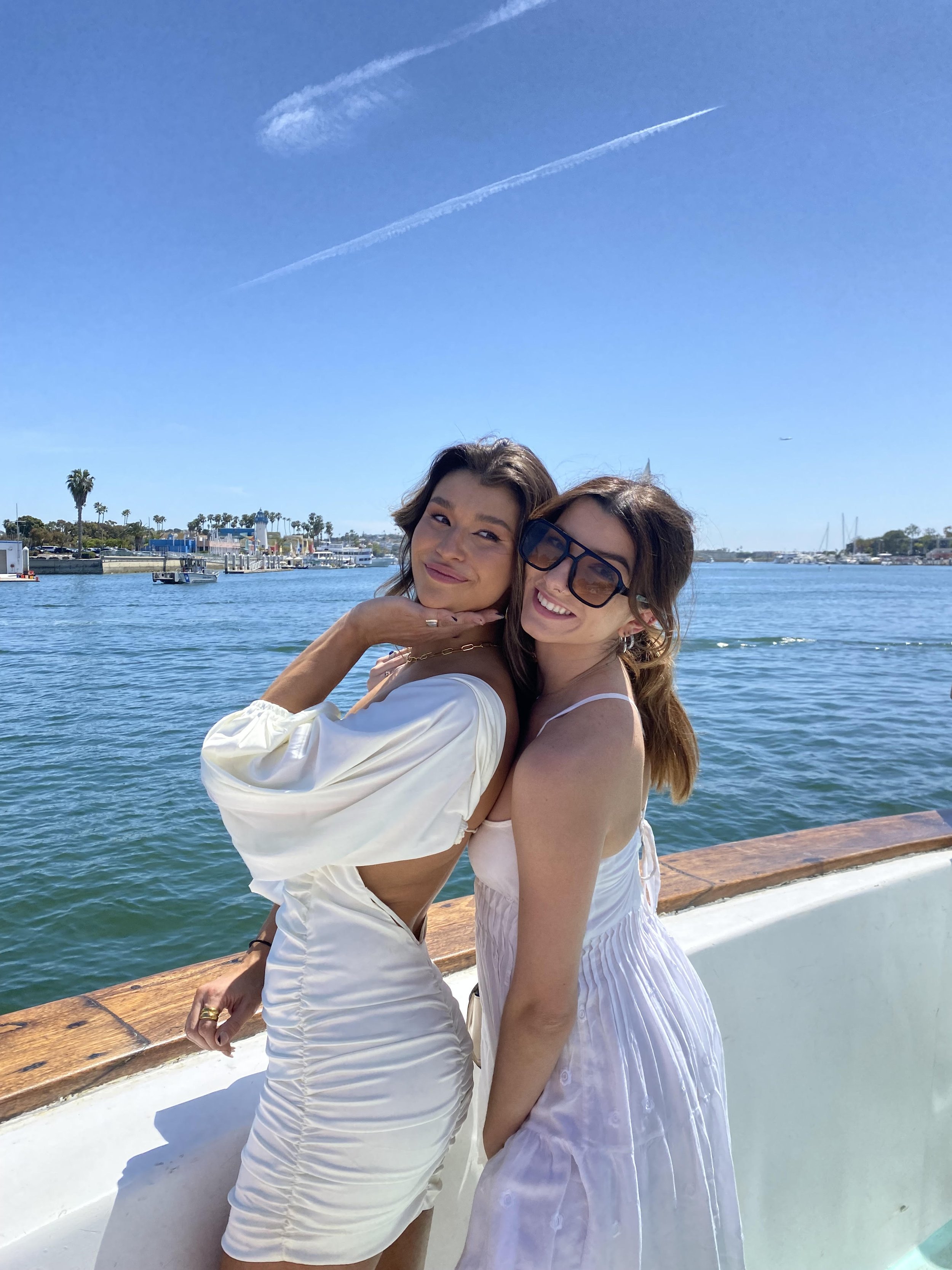 Friends posing on Sea Trek with Marina del Rey harbor behind them