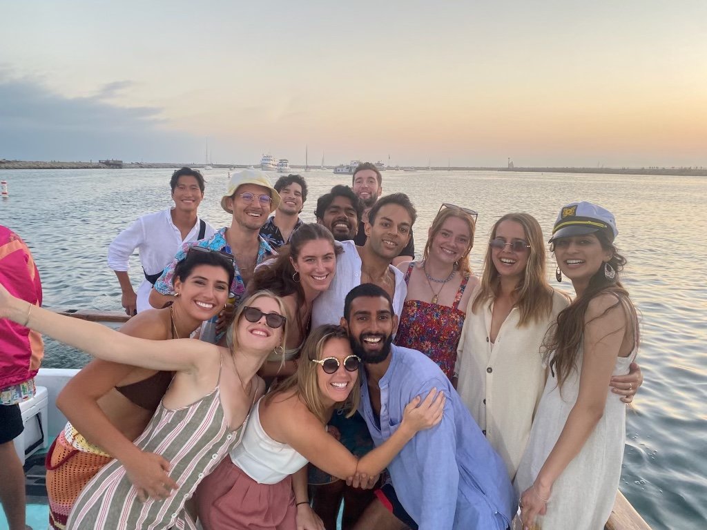 Group of guests smiling on Sea Trek during a private sunset charter