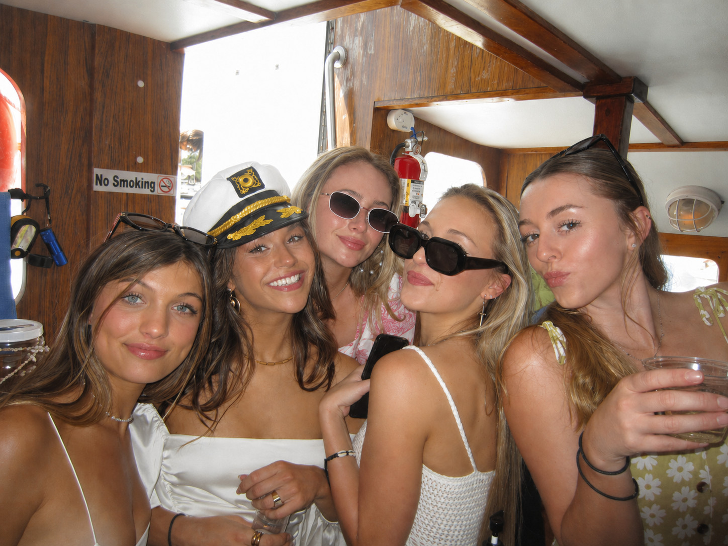 Friends posing inside the Sea Trek galley during a private celebration charter